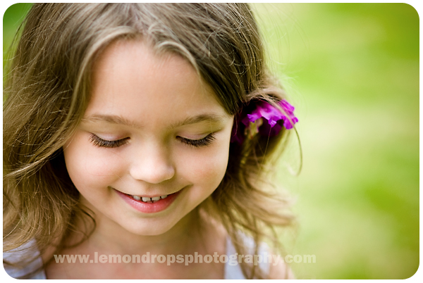 flower girl miss K with a flower in her hair